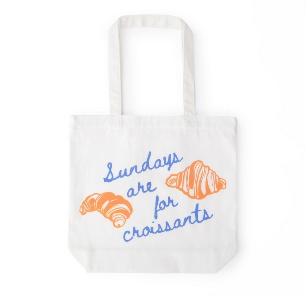 Target Bullseye Croissant White Tote Bag with Orange and Blue Print.